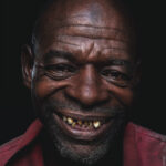 Smiling Man Portrait by Muntaka Chasant
