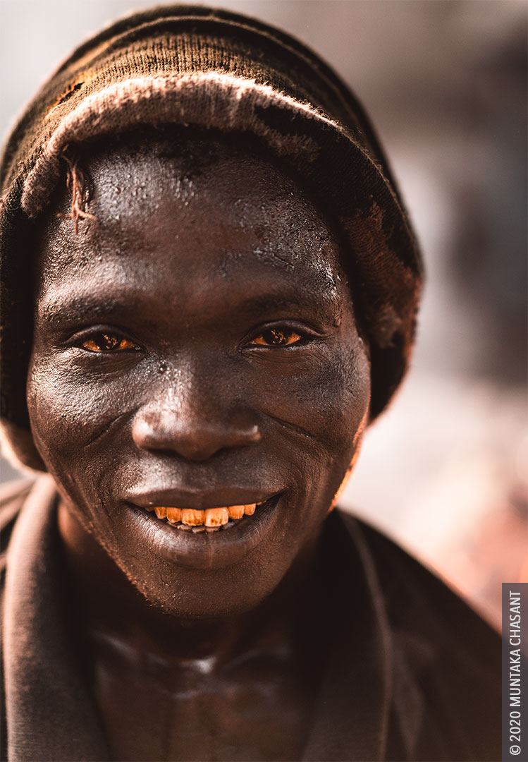 Hard-working man photo: Urban poor man looking sternly at the camera in Accra, Ghana. © 2020 Muntaka Chasant