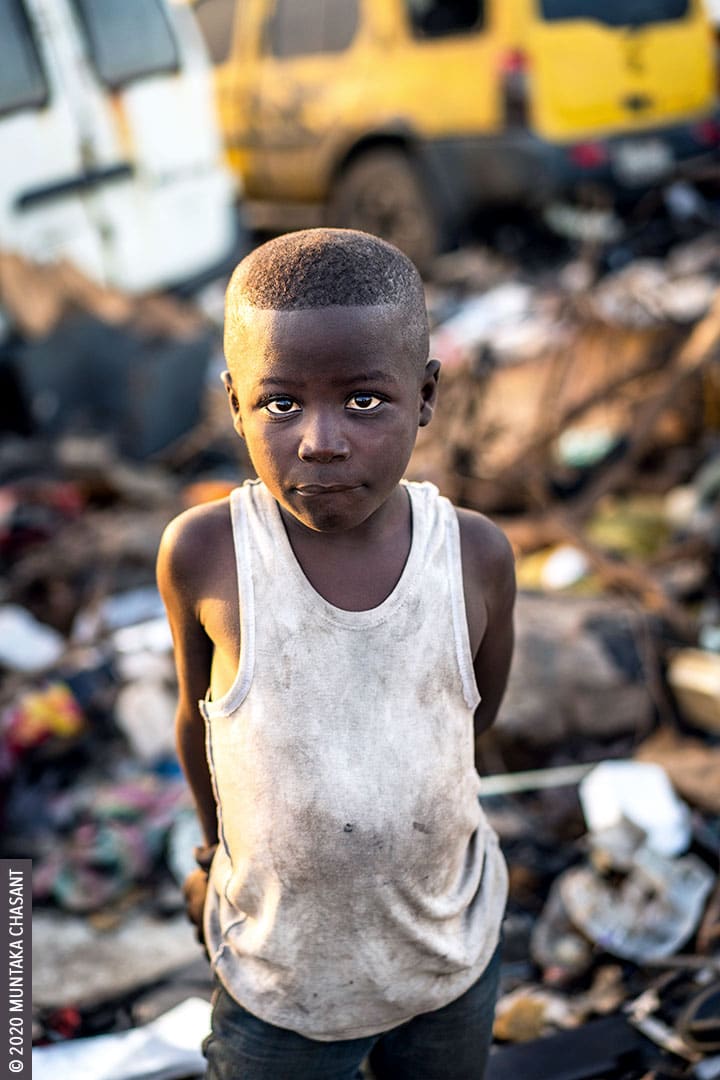 Child Labour: Akufo-Addo is an 8-year-old urban poor and engaged in hazardous child labour at Agbogbloshie, Ghana. Children working in hazardous environments at Agbogbloshie are exposed to heavy metals such as arsenic, cadmium, lead, chromium, and mercury. Roughly around 19 million children below the age of 12 years are in hazardous child labour worldwide, according to the ILO. © 2020 Muntaka Chasant