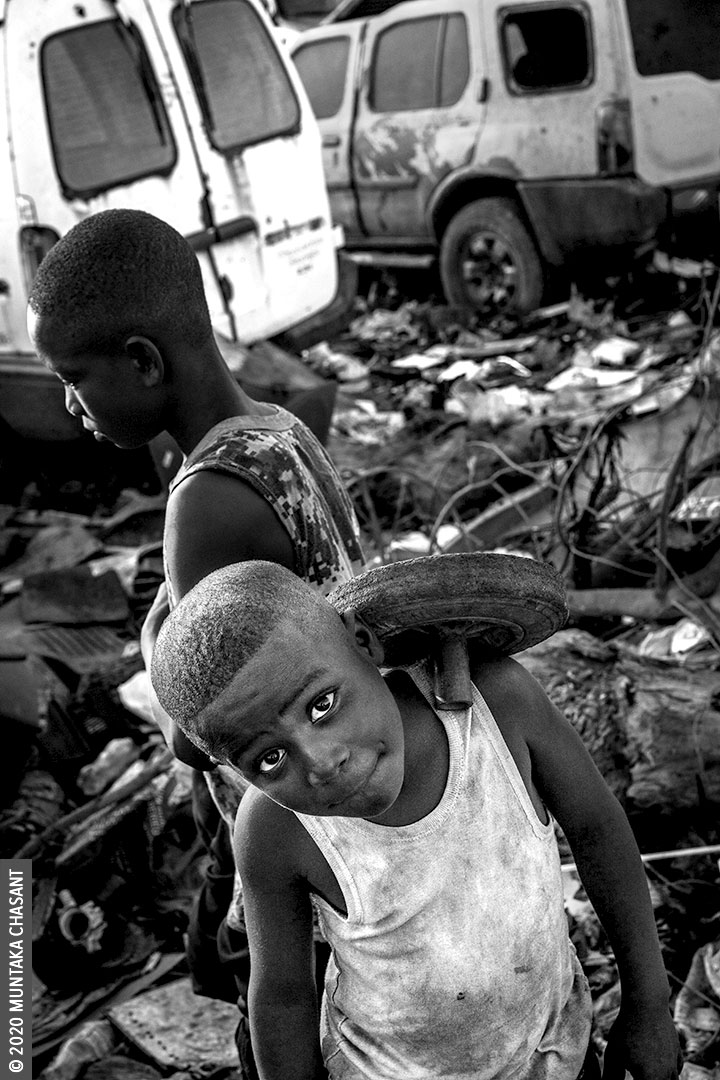 Child Labour: An 8-year-old boy engaged in hazardous child labour play on an e-waste dump at Agbogbloshie, Ghana. Around 19 million children below the age of 12 years are in hazardous child labour worldwide, the ILO statistics show. UNICEF estimates that around 2 million children in Ghana aged 5-17 years are in child labour. About 385 million children worldwide live in extreme poverty and survive on less than $2 a day, according to UNICEF. This represents about half of the world’s extreme poor. © 2020 Muntaka Chasant
