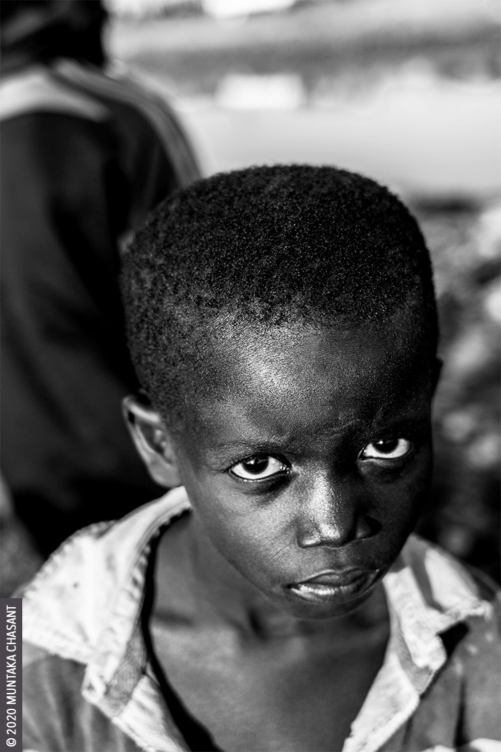 Child Poverty: Engaged in hazardous child labour, 7-year-old boy Kwadwo Michael handpicks scrap metals and discarded e-waste components in the soil at Agbogbloshie, an area renowned for its heavy metals contamination. He is exposed to toxic materials such as lead, mercury, arsenic, cadmium, and chromium from the informal recycling of e-waste around the area. 19 million children below the age of 12 years are in hazardous child labour worldwide, the ILO statistics show. © 2020 Muntaka Chasant