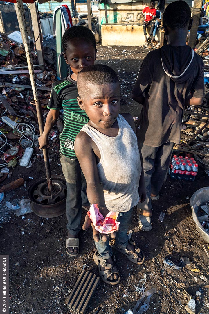 Child Labour: 8 years old Agbogbloshie hazardous worker displays how much he was paid for selling scrap metals at Agbogbloshie, Ghana. 73 million children between 5 and 17 years worldwide are in hazardous child labour, according to ILO. The minimum age for hazardous work in Ghana is 18, according to Section 91 of the Children’s Act, 1998 (Act 560). © 2020 Muntaka Chasant