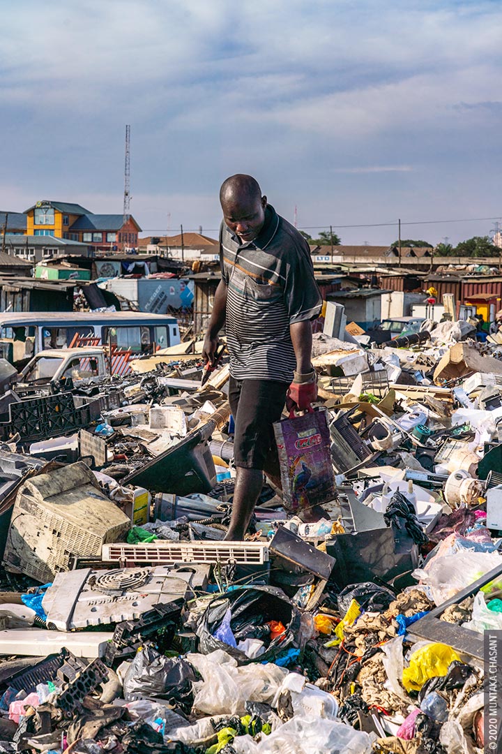 Urban Poverty: An urban poor man is looking for discarded e-waste components at Agbogbloshie, Ghana. Hundreds of young people around Agbogbloshie make a living by sifting through dumpsites for precious metals and discarded e-waste components. This exposes them to heavy metals such as lead, mercury, and chromium. © 2020 Muntaka Chasant