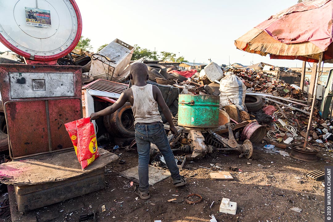 Child Labour: 8 years old hazardous child labourer nicknamed after Ghana's current President (Akufo-Addo) weighs metal scraps at Agbogbloshie, Ghana. Around 73 million children between 5 and 17 years worldwide are in hazardous child labour, according to the International Labour Organization. © 2020 Muntaka Chasant