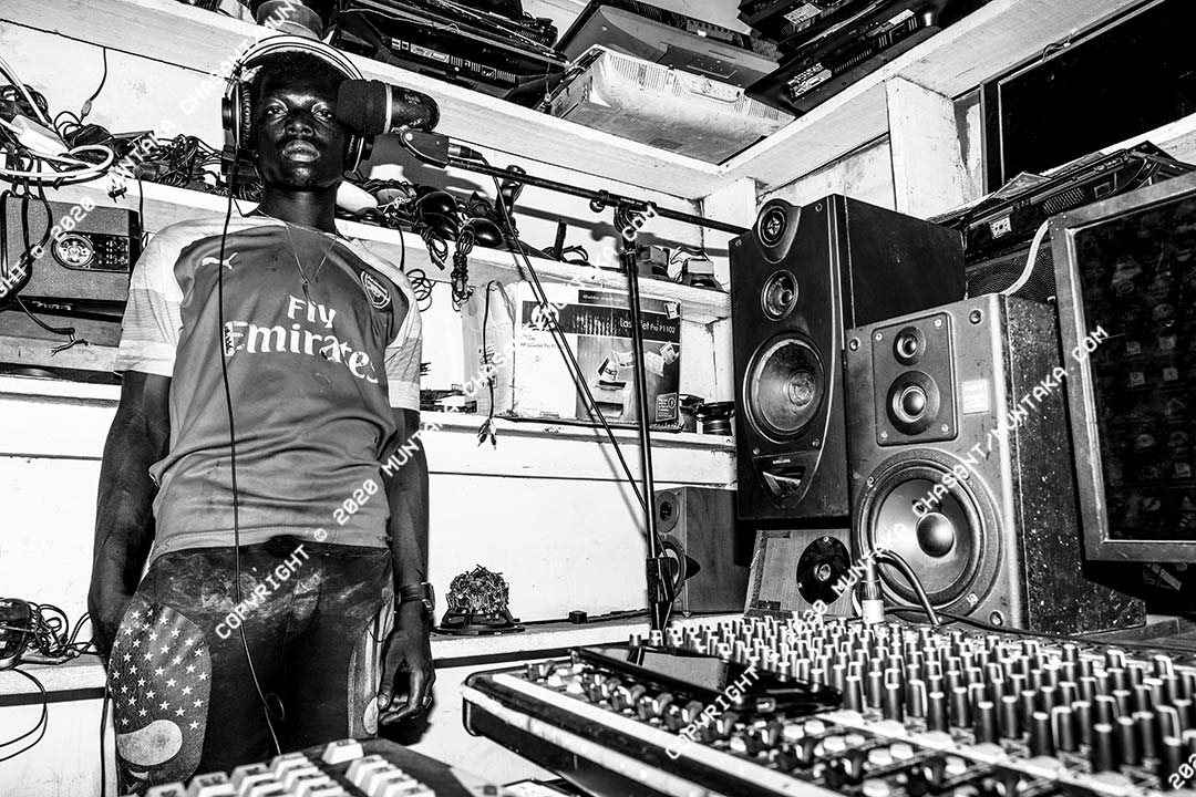 An aspiring musician rehearses in a recording studio inside the Sodom and Gomorrah (Agbogbloshie) slum in Accra, Ghana. Copyright © 2020 Muntaka Chasant