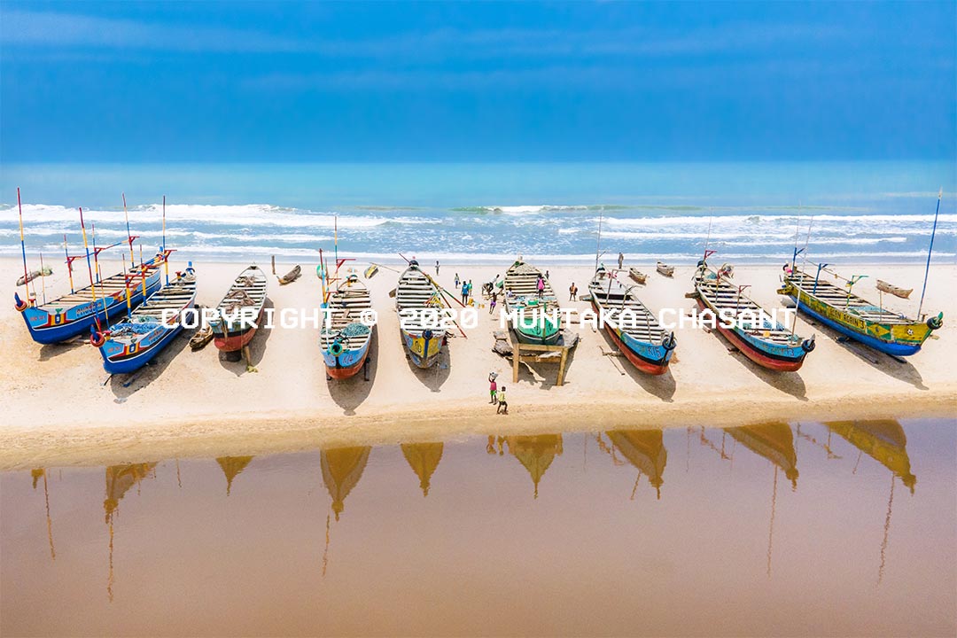 Climate change image: Amisa Lagoon and the Gulf of Guinea with fishing canoes parked in the middle. The canoes had been parked there for months because the fishermen get zero fish when they go out to sea. Fisheries is Ghana is already in decline, but climate change makes it worse. Copyright © 2020 Muntaka Chasant