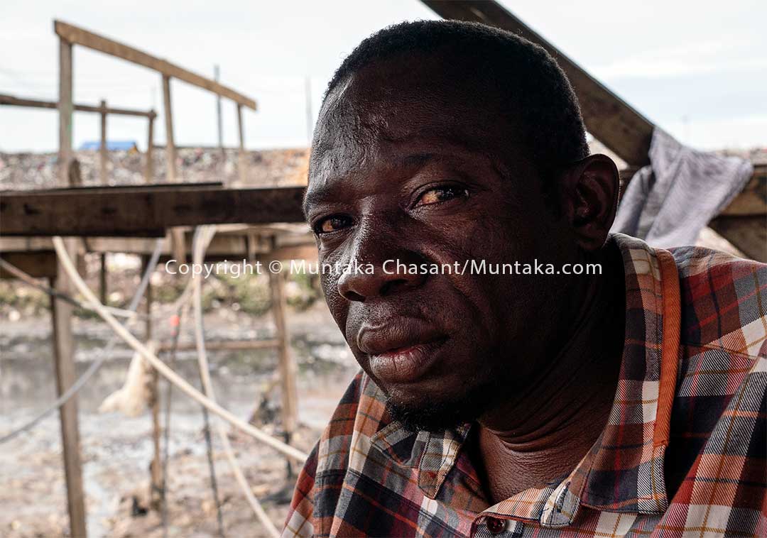 Yakubu Abukari built a makeshift wooden bridge to connect his community to nearby areas. Accra, Ghana. Copyright © 2020 Muntaka Chasant
