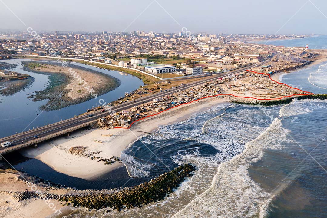 Korle Lagoon: Aerial view of Korle Lagoon estuarine environment near Jamestown in Accra, Ghana. Fed by the Odaw River, the Korle Lagoon collects industrial effluent, wastewater, and all kinds of debris from Accra's major drainage channels and empties them into the Gulf of Guinea. Copyright © 2020 Muntaka Chasant