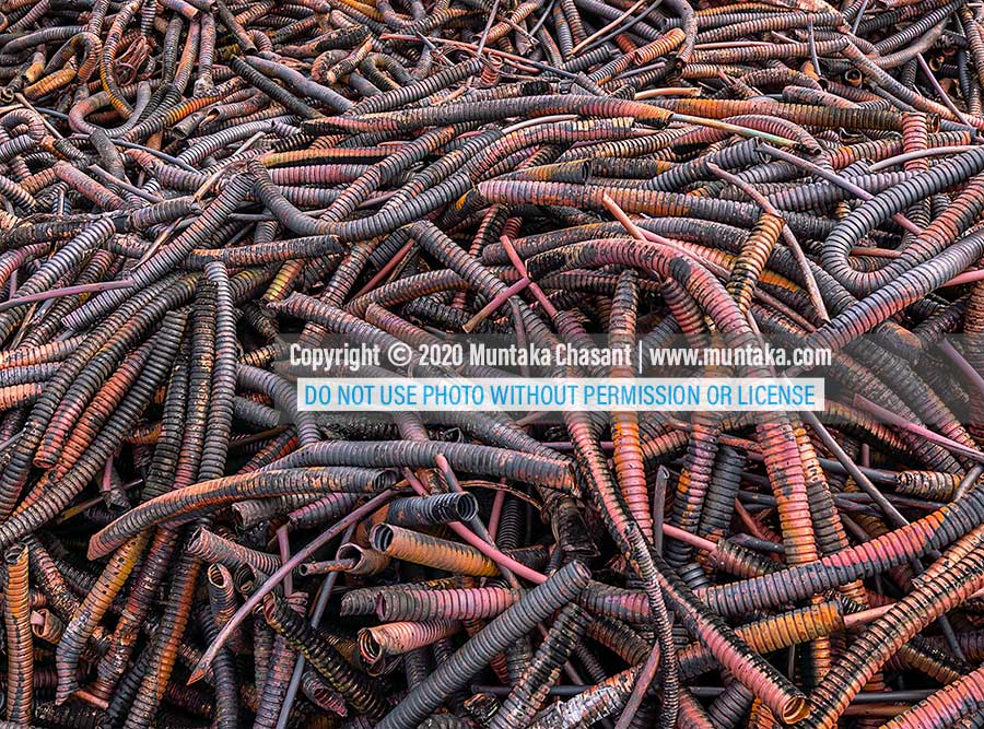 Heliax coaxial cable recycling at Agbogbloshie: Photograph of heliax cables that had been burned in the open to reclaim copper. PVC/PE insulated, open incineration released toxic substances into the environment. Copyright © 2020 Muntaka Chasant