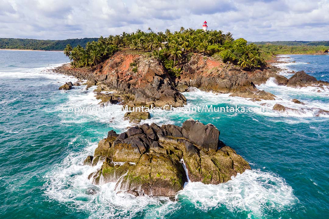 Aerial view of Cape Three Points, the southernmost tip of Ghana. This islet is also the nearest land to the Null Island — 570 km south — at zero degrees latitude and longitude (0°N 0°E) in the Atlantic Ocean. Copyright © Muntaka Chasant