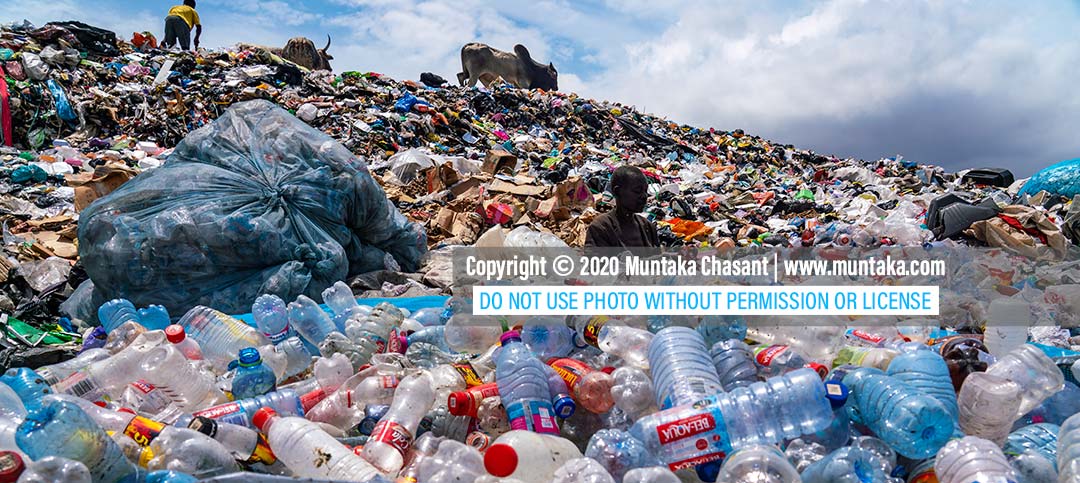 Plastic pollution image: Urban poor man sorts recyclable plastics at a dump in Accra, Ghana. September 2020. Copyright © 2020 Muntaka Chasant