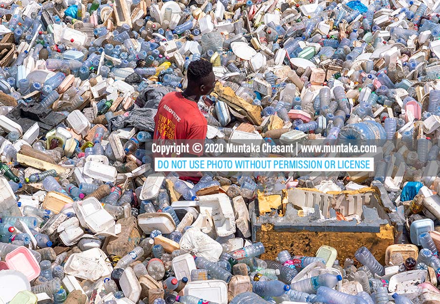 Plastic waste collection: Man recovers plastic waste from the Korle Lagoon in Accra, Ghana, to sell to recyclers. Copyright © 2020 Muntaka Chasant