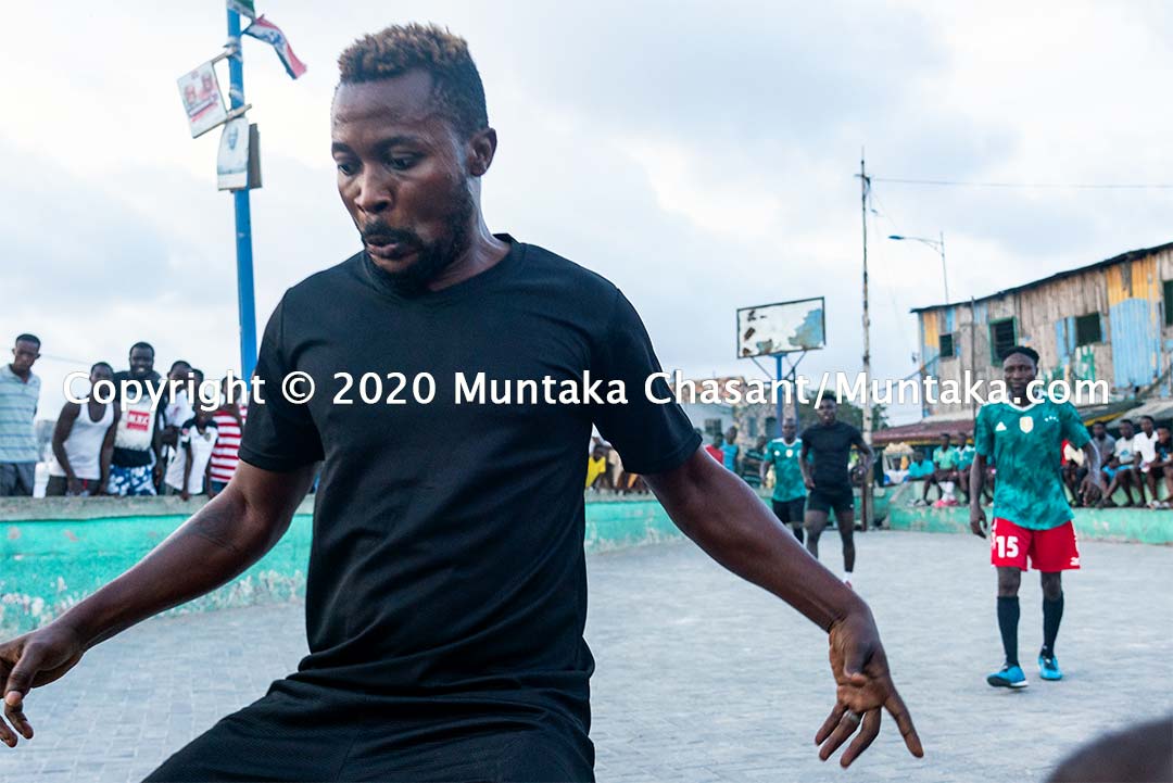 Football in Ghana: Man dribbles as he plays street football in Ghana. Copyright © 2020 Muntaka Chasant