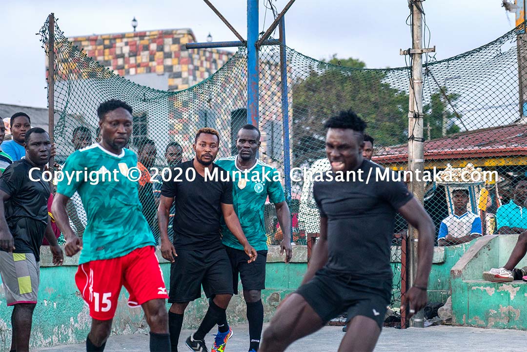 Former IBF welterweight champion Joshua Clottey plays street football in Accra, Ghana. Copyright © 2020 Muntaka Chasant