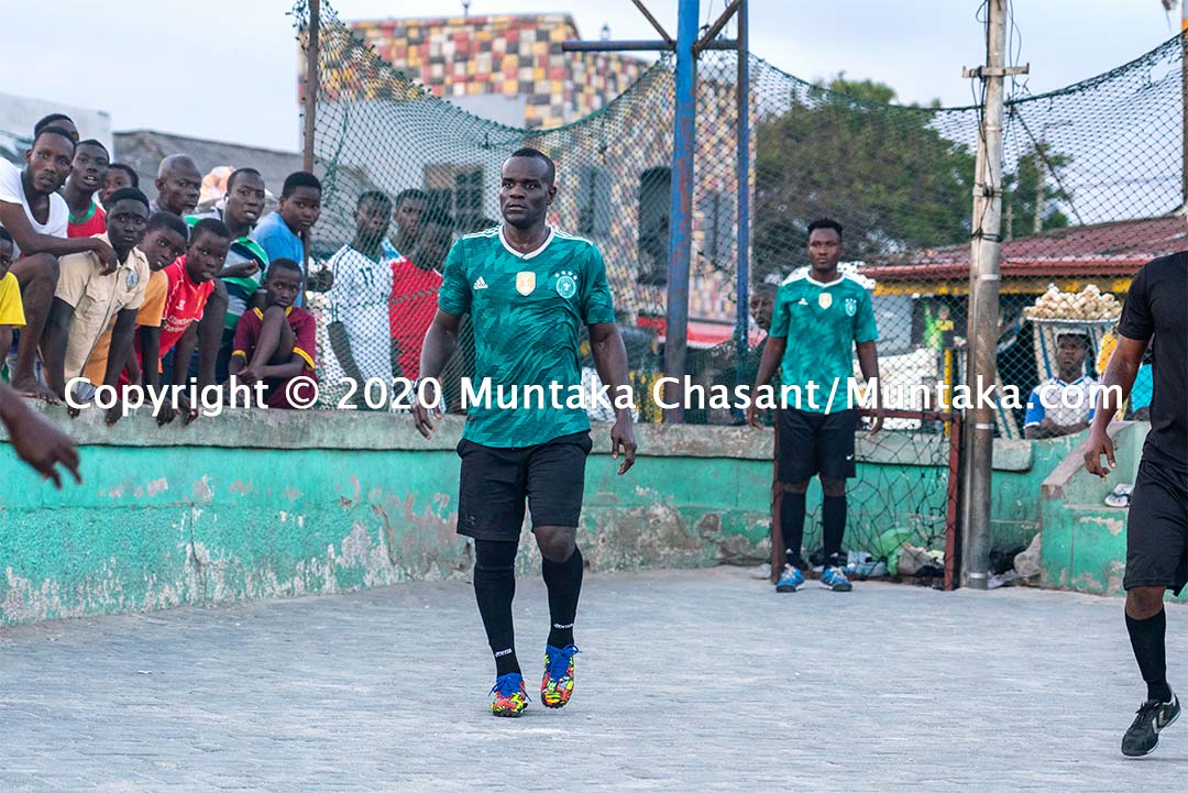 The professional boxer Joshua Clottey plays street football in Accra, Ghana. Copyright © 2020 Muntaka Chasant