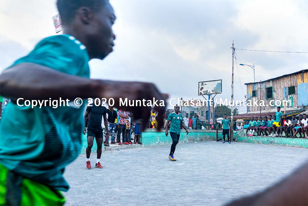 Street soccer in Ghana: Jamestown residents, including the Ghanaian former professional boxer Joshua Clottey, play soccer on concrete at Jamestown, a suburb in Accra, Ghana's capital city. Copyright © 2020 Muntaka Chasant