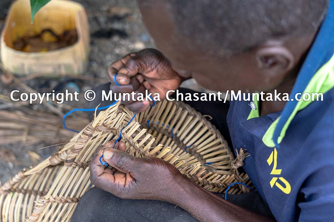 Man handmaking blue crab trap. Accra, Ghana. Copyright © Muntaka Chasant