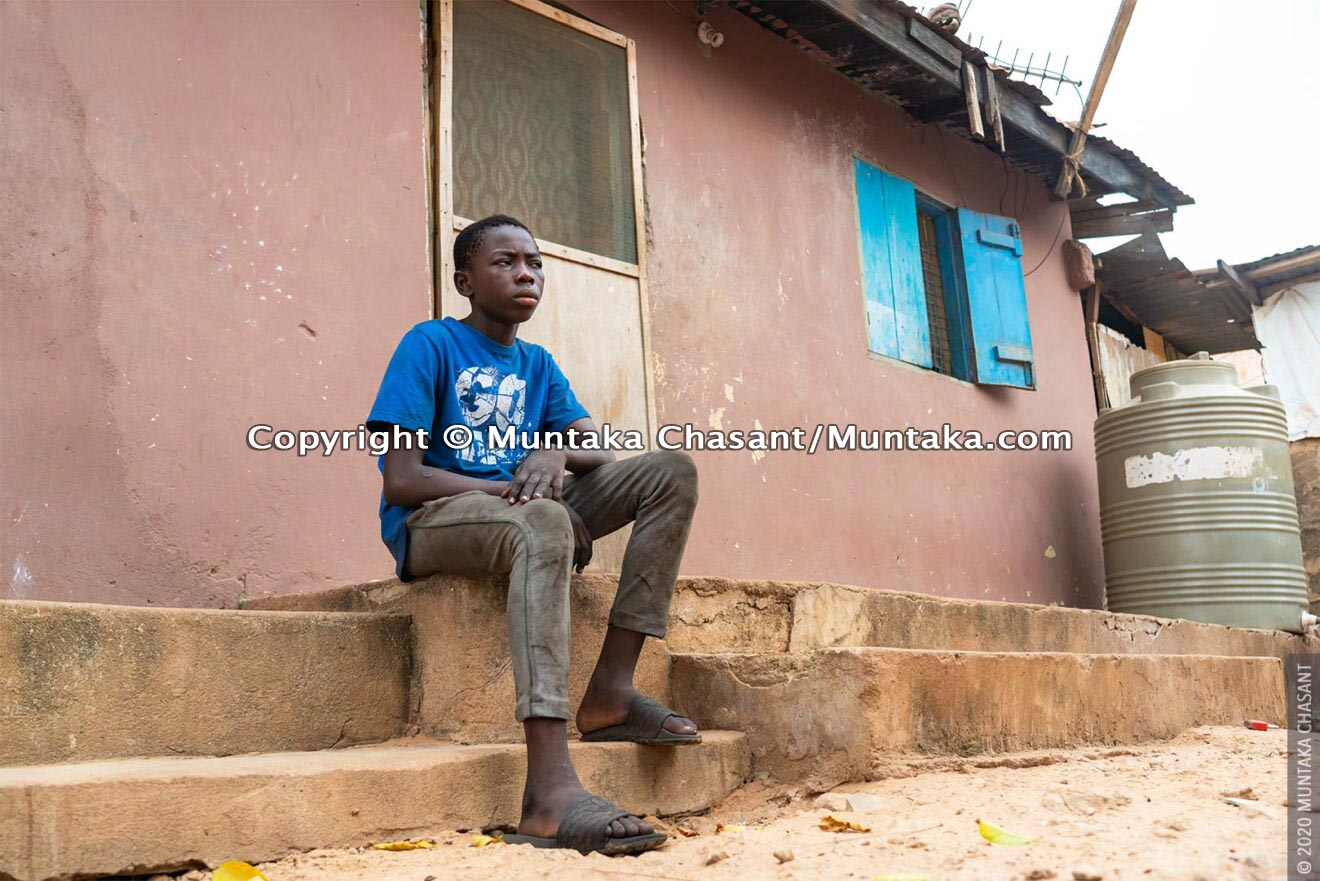 Malik, 14 years, now home in his family's house at Madina, Accra. February 19, 2020. © 2020 Muntaka Chasant