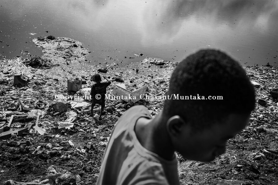 Child labourers on the banks of the Korle Lagoon, Accra, Ghana. Copyright © Muntaka Chasant