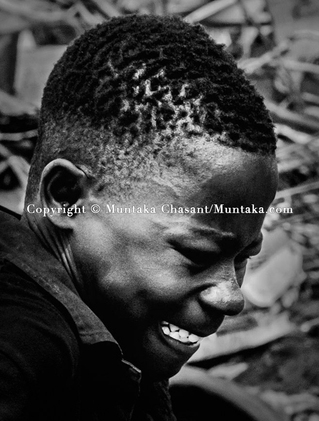 Pain and struggles of an adolescent boy on the banks of the Korle Lagoon. Copyright © Muntaka Chasant