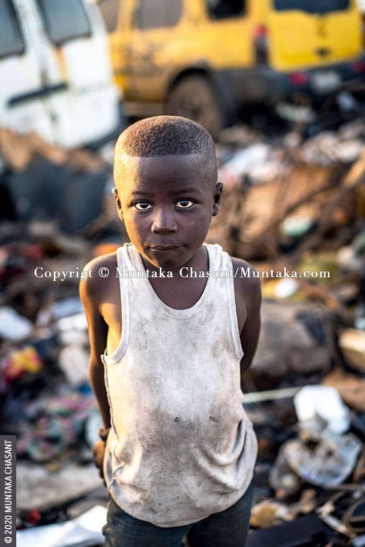 Child Labour: Akufo-Addo is an 8-year-old urban poor and engaged in hazardous child labour at Agbogbloshie, Ghana. Children working in hazardous environments at Agbogbloshie are exposed to heavy metals, including arsenic, cadmium, lead, chromium, and mercury. Roughly around 19 million children worldwide below the age of 12 years are in hazardous child labour, according to the ILO. © 2020 Muntaka Chasant