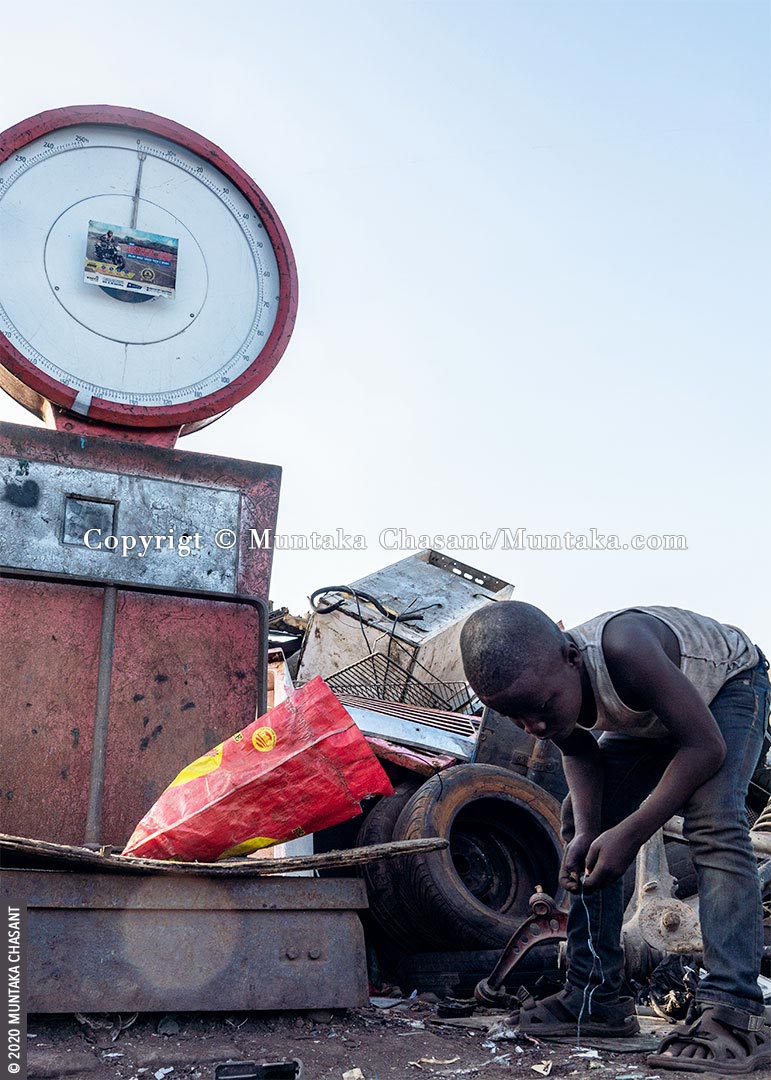 Child Labour: Akufo-Addo is an 8 years old boy engaged in hazardous child labour at Agbogbloshie, Ghana. 62% of all children in hazardous child labour are boys, according to the ILO. © 2020 Muntaka Chasant