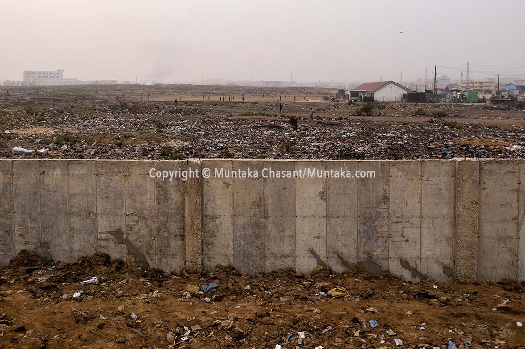 Taken on 17 February 2023, an aerial photo shows a concrete wall built (ongoing) around the reclaimed land following the demolition of the Agbogbloshie Scrapyard and nearby sites. I can confirm that no scrap dealer has yet relocated to the Teacher Mante site after nearly two year. For most of the workers, the location doesn’t seem to chime with how their work is organized. For now, e-waste practices and end-of-life vehicle recycling remain scattered all over Accra and Tema. Copyright © Muntaka Chasant