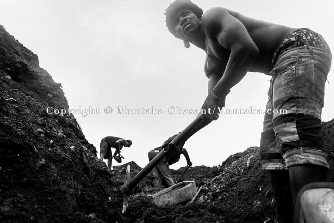 September 14, 2021: Urban poor men search for scrap metal buried deep under the surface of the demolished Agbogbloshie Scrapyard site. Copyright © Muntaka Chasant