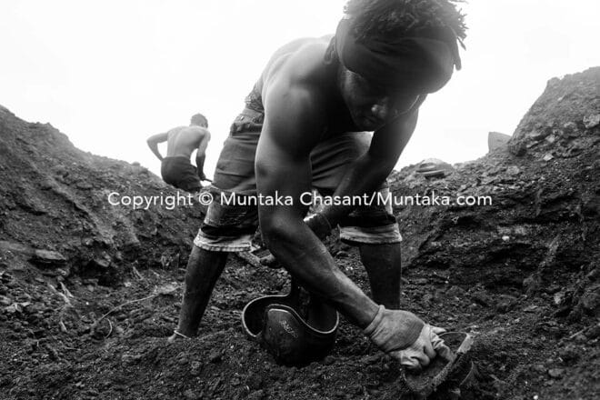 Dessu searched for scrap metal buried under the surface of the demolished AgbogbloshieScrapyard site. Copyright © Muntaka Chasant